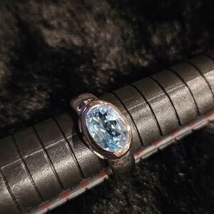 Oval blue Topaz ring in 925 sterling silver setting. Size 7